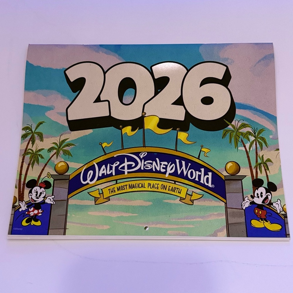Disney 2026 Passholder Calendar with Mickey Mouse and Blue Sky